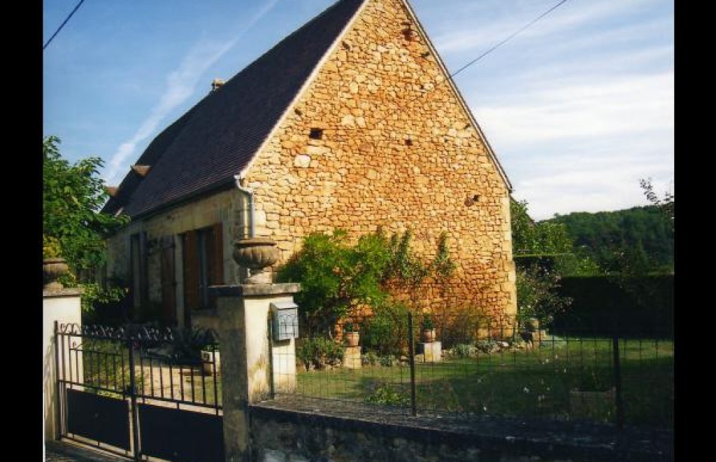 Maison mitoyenne à celle...